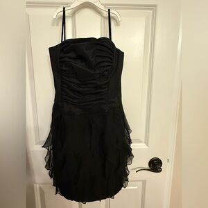 Cache Black Strapless Dress with Ruffle Detail and eye catching back detail.